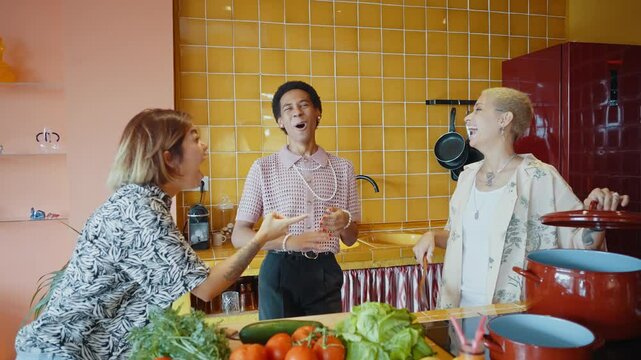 Group of friends bonding at home, LGBTQ and diversity concepts - Homosexual couple and fluid gender non binary young man with cross dressing clothing style having fun in the apartment, LGBT people