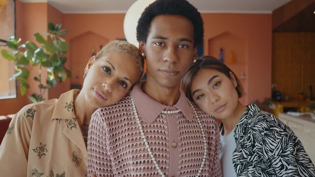 Group of friends bonding at home, LGBTQ and diversity concepts - Homosexual couple and fluid gender non binary young man with cross dressing clothing style having fun in the apartment, LGBT people