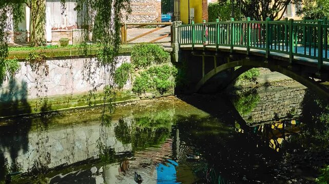 Seriola canal and bridge in park. Valmarana Salvi gardens are public garden located in historic center of Vicenza, Italy, adjacent to walls of Piazza Castello, in Piazzale De Gasperi.