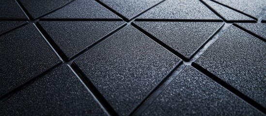 Abstract pattern of textured dark triangles with deep lines forming geometric shapes