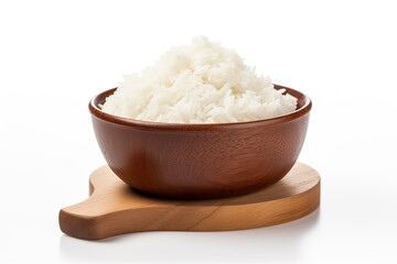 White background with a wooden cup containing rice