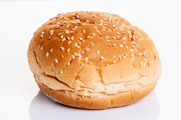 Golden sesame seed hamburger bun with a fluffy texture and crisp crust, isolated on a white background. Perfect for burgers, sandwiches, and food themes