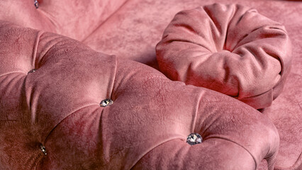 red sofa with large rhinestones close-up
