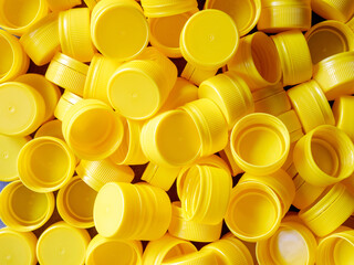 yellow plastic bottle caps.Recycling collection and production processing plastic bottle caps...