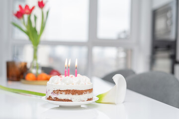Birthday cake with pink candles. Cheesecake with raspberries