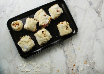 Raw pastry buns view from above. The concept of homemade baking