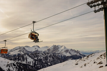 Children and adults, happy family in winter clothing at ski vacation, skiing, winter