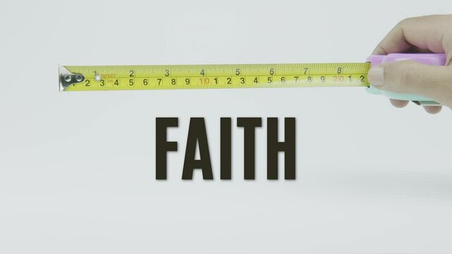 "Faith" text with a tape measure on a white background, symbolizing precision, accuracy, and measurement in a clean, minimal style