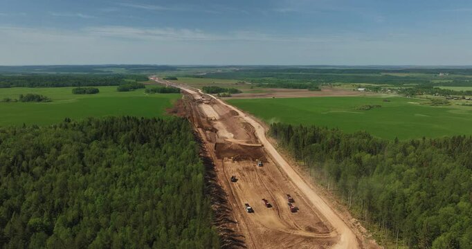 Highway construction. Construction robots preparing road surfaces.Aerial drone view.