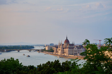 Hungarian Parliament Building in Budapest at sunset with reflection in Danube River. Neo Gothic architecture and famous landmark of Hungary