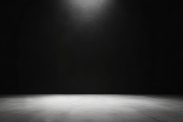 An empty dark room with a spotlight illuminating the floor