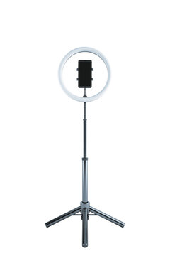 Ring light with smartphone holder on tripod stand, isolated on white background. Ideal for content creation, vlogging, and graphy. 3D Rendering.
