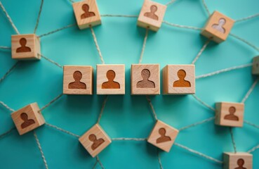 Wooden cubes with person icon connected by threads. Team interaction, HR management concept. Teamwork, collaboration, communication, cooperation, oneness. Manpower, organisation, leadership, synergy,