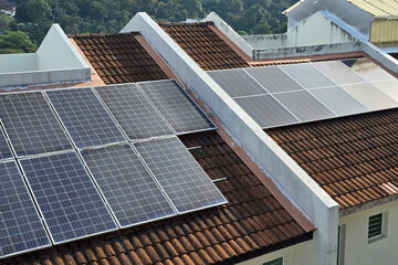 Fototapeta premium Solar panels installed on a residential rooftop for renewable energy and sustainable living.
