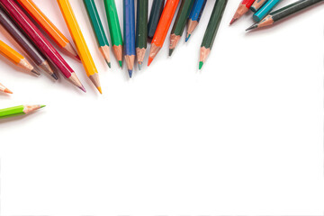 Obraz premium Multi-colored pencils on a white background. Drawing, notes, writing.