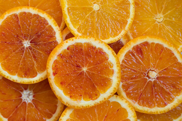 Fresh, vibrant red-orange oranges on a white background, perfect for healthy eating, vitamins, and nutrition-related content.