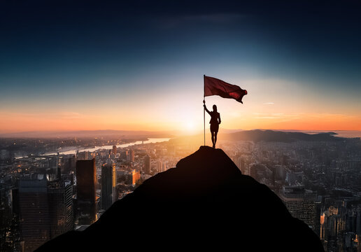 Silhouette of person with flag on mountain peak against a vibrant sunset.  City skyline visible below. Symbolizes success, achievement, and reaching goals with ambition.