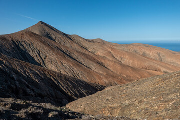 The rugged countryside of Fuerteventura with volcanic mountains.