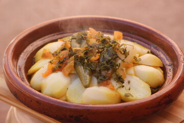 A close-up of a fresh tajine with potatoes
