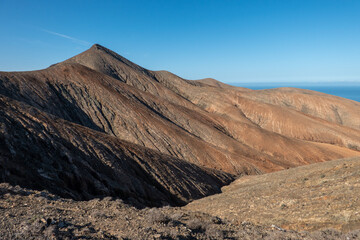 The rugged countryside of Fuerteventura with volcanic mountains.