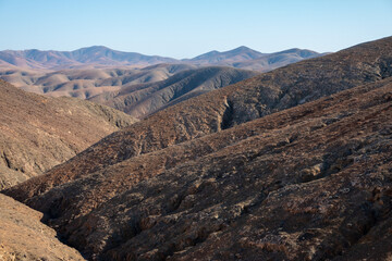 The rugged countryside of Fuerteventura with volcanic mountains.