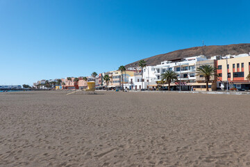 The coastal town of Gran Tarajal in Fuerteventura. Beach sand and sun