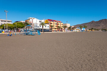 The coastal town of Gran Tarajal in Fuerteventura. Beach sand and sun