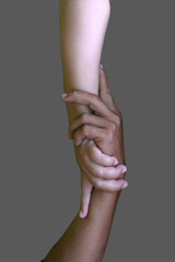 Vertical help hands holding together representing friendship, partnership, help and hope, donation,...