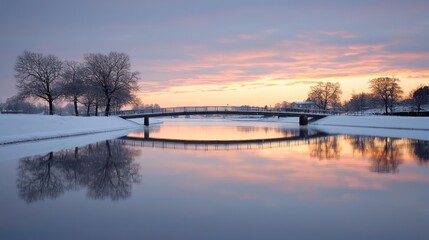 Winter Sunset Over a Snow Covered River with Bridge Reflection