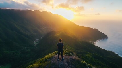 Fototapeta premium Stunning sunset view from a mountain peak with a person gazing towards the horizon and golden sunlight : Generative AI