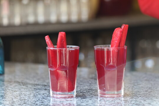 Fermented black carrot juice (known as shalgam or şalgam) with carrot pieces in a glass