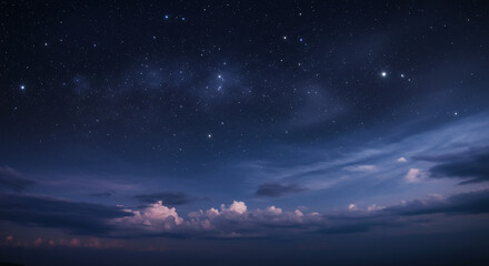  A vast night sky filled with clouds and twinkling stars, creating a serene and cosmic atmosphere
