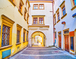 The narrow lane with a gates in a maze of medieval streets in old town of Brno, Czech Republic © efesenko