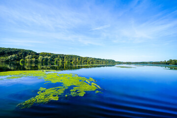 View of Lake Kemnader and the surrounding green nature in the Ruhr area. Landscape at the Ruhr reservoir near Bochum and Hattingen. Kemnader See.
