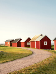 Fishing cottages lit by the dawn light at Kapelludden, Öland