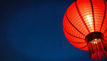 Red paper lantern glowing against a dark blue sky for blogs, websites, cultural events, decorative designs, Asian-themed projects, and festive illustrations
