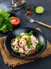 Spicy seafood salad, Thai spicy food recipe, Yum Spicy seafood on the black table