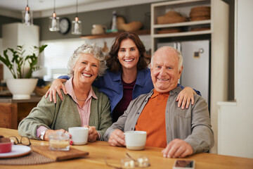 Portrait of happy smiling senior parents with daughter at home