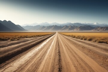 dirt road in the middle of a desert with mountains in the background