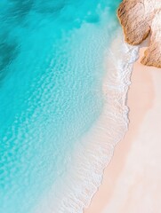 Obraz premium Aerial view of pristine beach with turquoise waters and golden sands