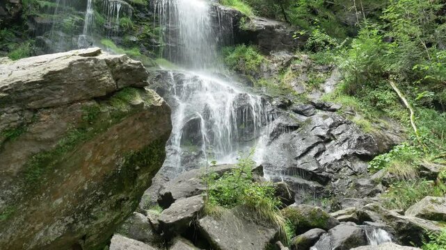 Majestic Zweribach Waterfall in the heart of the Black Forest &ndash; roaring natural wonder with moss-covered rocks, clear water, and an idyllic forest landscape