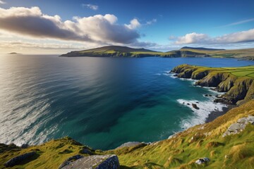 arafed view of a beautiful ocean with a grassy hill in the background