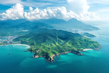 Fototapeta premium Breathtaking aerial view of tropical island coastline with lush green mountains and turquoise water