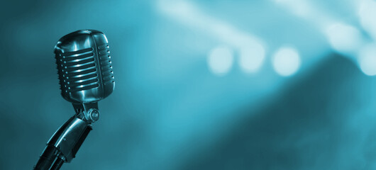 vintage microphone on blue background