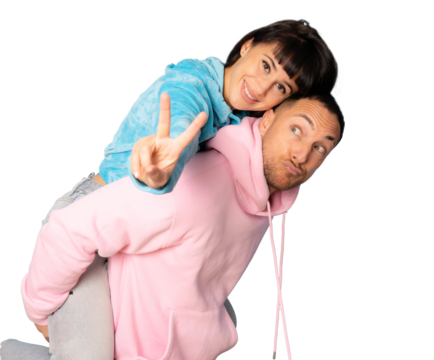 Young couple in casual sport clothing hugging each other isolated over transparent background. PNG transparent