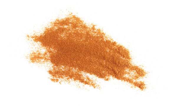 Pile cinnamon powder isolated on white background, with top view