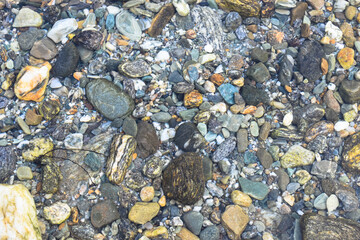 Scenic view of pebbles in mountain river