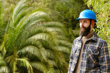 Ecological surveyor documenting biodiversity in lush forest environment, Field researcher, Urban...