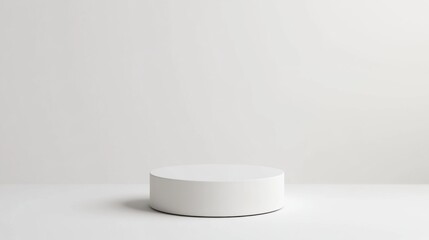 A simple white pedestal with ample copy space around it, ideal for product photography or minimalist design.