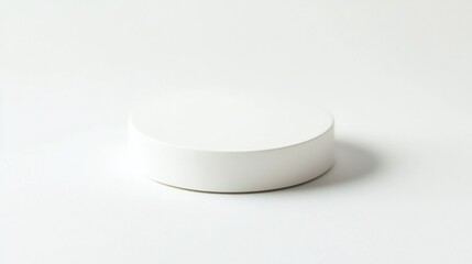 A white pedestal on a clean, minimalistic white background, with blank space for any product or marketing message.